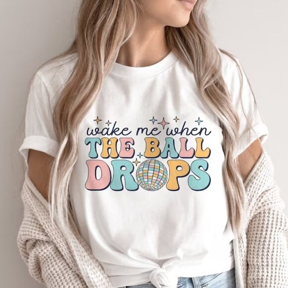 Wake Me When The Ball Drops Funny New Year 2026 Celebration Graphic T-Shirt 90 - Picture 1 of 5